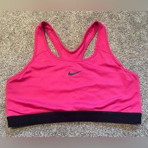 Pink and black Nike sports bra
